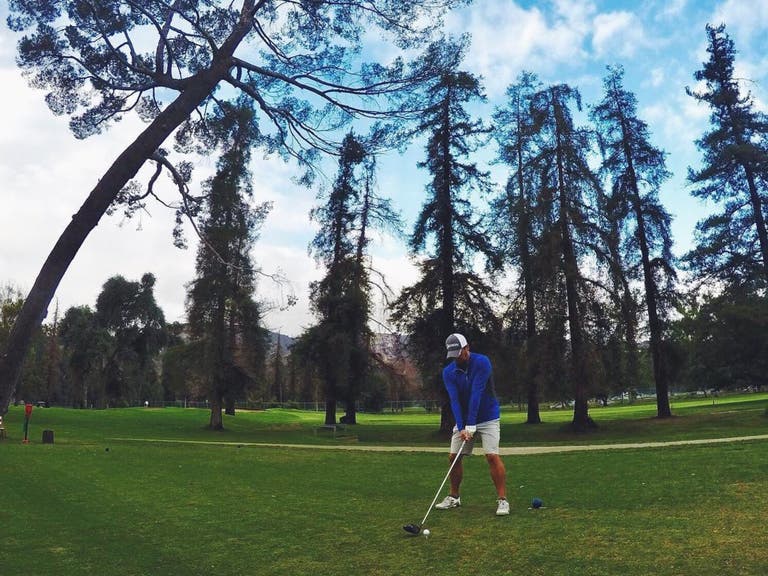 Golfer takes a swing at Harding Golf Course in Griffith Park
