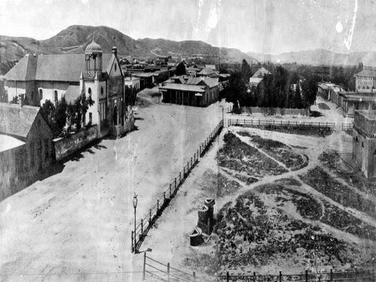 Panoramic view of Los Angeles Plaza and Old Plaza Church in 1869