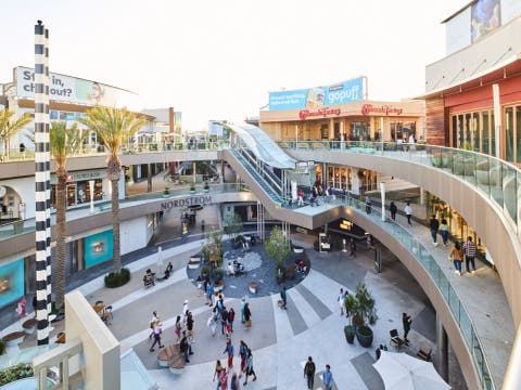 Outdoor Shopping Center with Upmarket Chain Retailers, a Movie